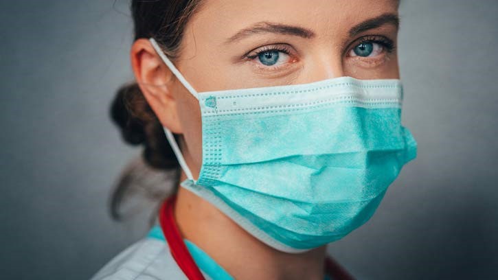 Image of a lady wearing a face mask.