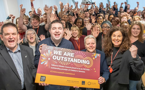 A picture of our Council Leader, Shaun Davies, celebrating with all our Children's Social Care staff and been awarded Outstanding by Ofsted