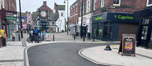 A picture of Wellington town centre with people in shopping.