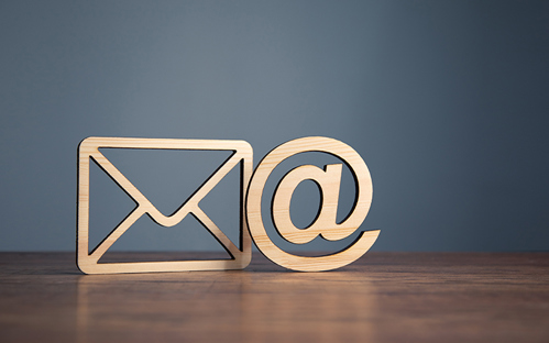 An illustration of an email symbol and envelope.