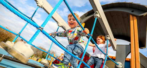 Picture of two children having fun and smiling at Telford Town Park