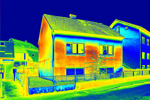 Infrared thermovision image showing lack of thermal insulation on a house.