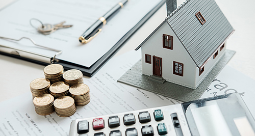 House model with real estate agent and customer discussing for contract to buy house, insurance or loan real estate background
