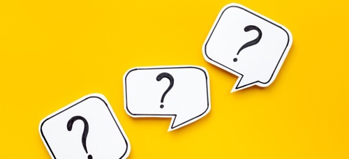 A graphic showing question marks in white speech bubbles on a yellow background