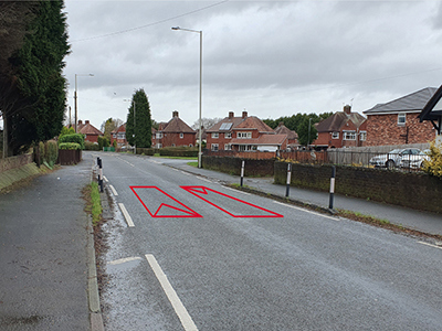 A photograph of a lane narrowing measures on a residential road
