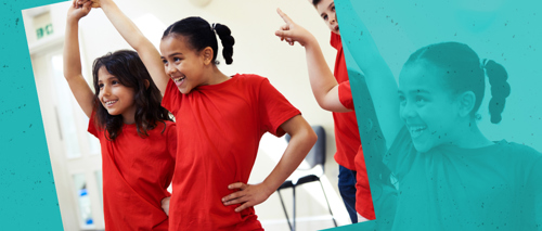 A photograph of children doing a dance routine
