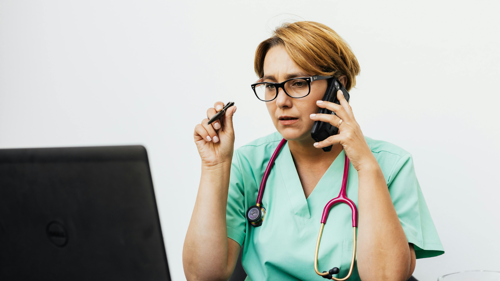 An image of a doctor talking on the phone