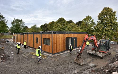 A picture of the building site with multiple builders on site working on the Oakengates Nursery school relocation project.