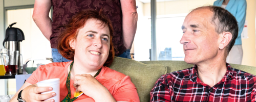 Two people sat enjoying themselves.