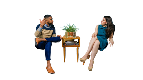 Two people sat in chairs talking