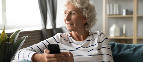 An older lady using a mobile phone