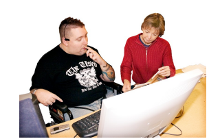 Two people working at a computer