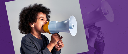 A photograph of a child speaking through a megaphone