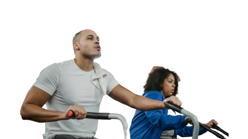 Two people using gym equipment