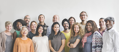 A picture of a group of diverse people all standing together