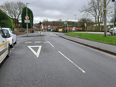 A photograph of a give way point in a residential road
